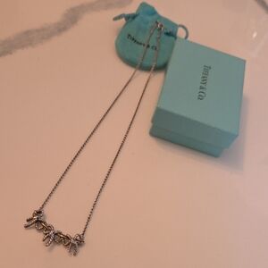 Tiffany & Co. Silver & 18k Yellow Gold(750) Charm Necklace